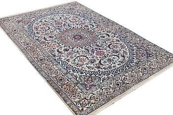 A Nain carpet, part silk, c. 293 x 199 cm.