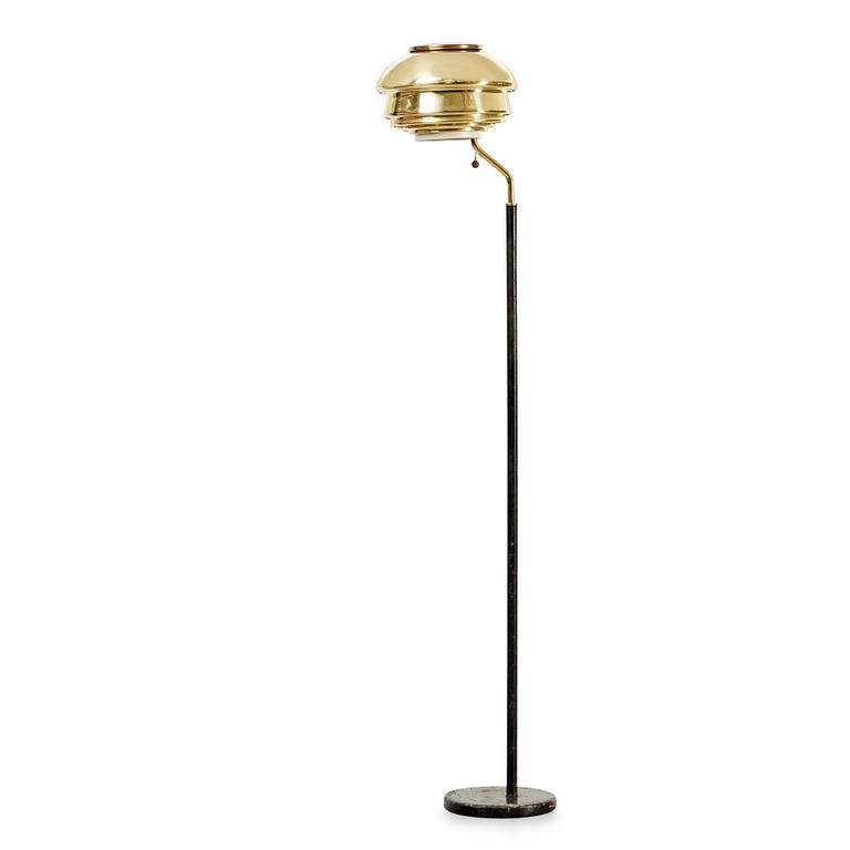 An Alvar Aalto 'A 808' brass and black leather floor lamp, Valaisinpaja, Finland late 1970's.