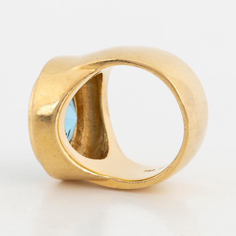A faceted topaz ring.
