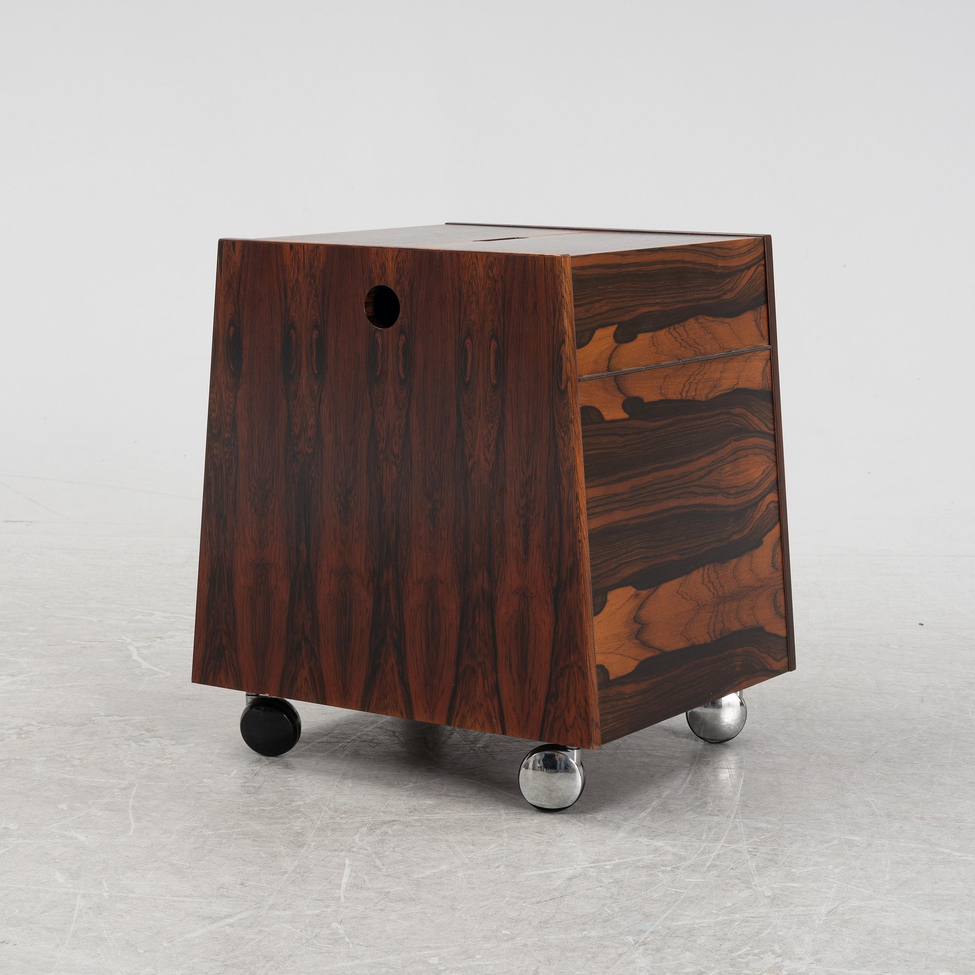 Rolf Hesland, a rosewood-veneered magazine rack/minibar from