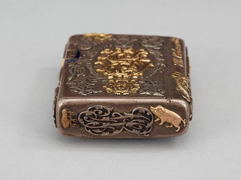 A CIGARRETTE Russian 19th century parcel gilt and enameld cigarette-case, makers mark of Michael Isakov, S.t Petersburg.
