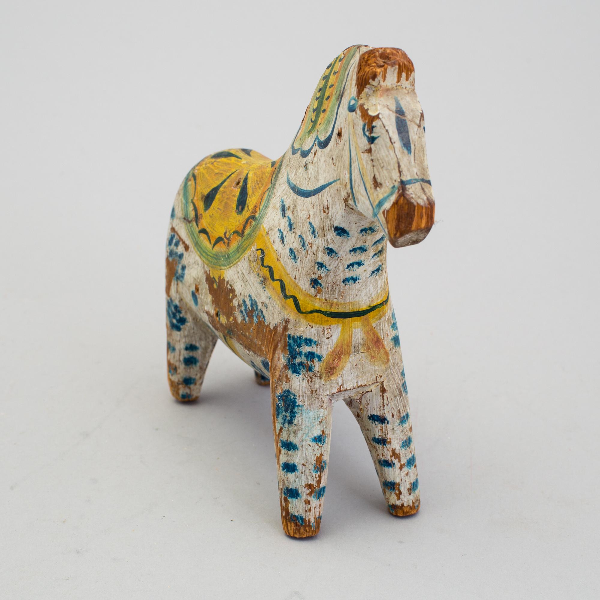 A painted folk art dala horse first half of the 20th century.