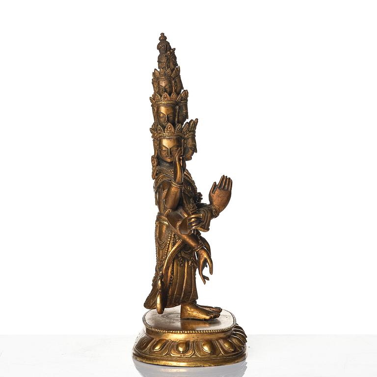 A Tibeto-Chinese gilt bronze figure of Avalokiteshvara Ekasdashamukra, 19th century.