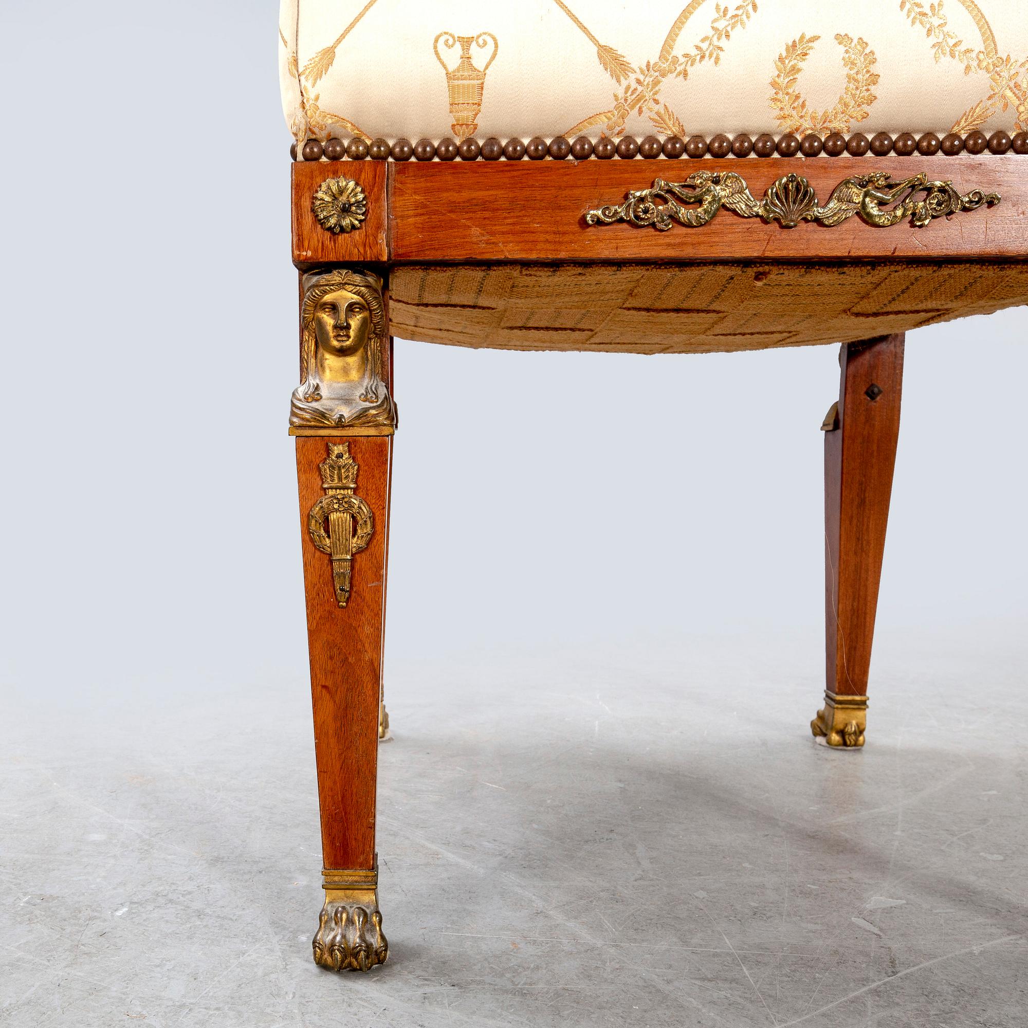 An Empire style mahogany stool around 1900.