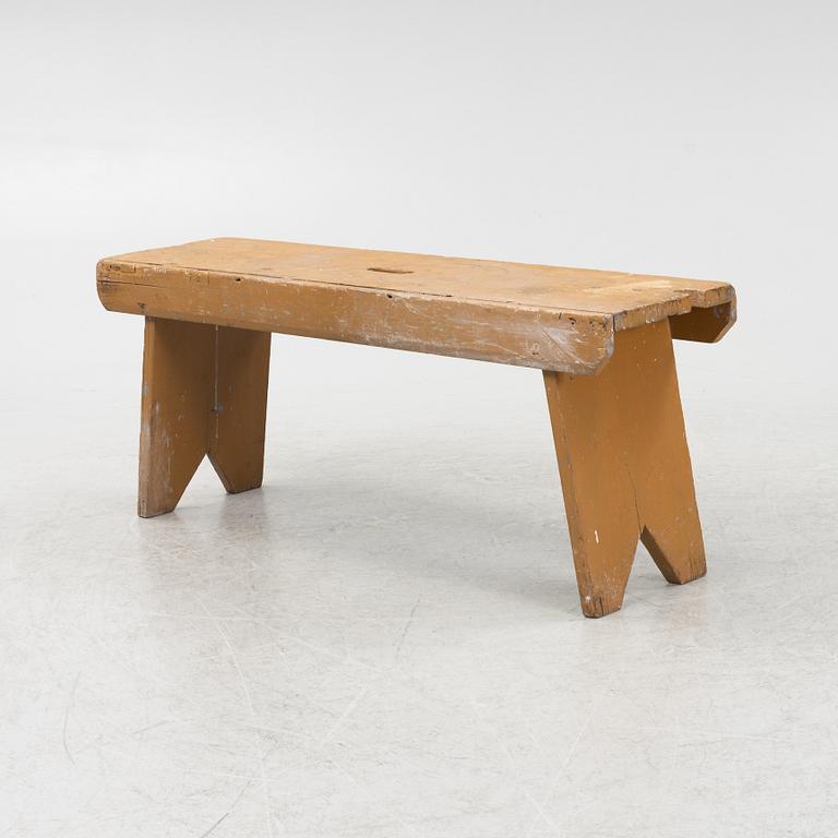 A painted bench, circa 1900.