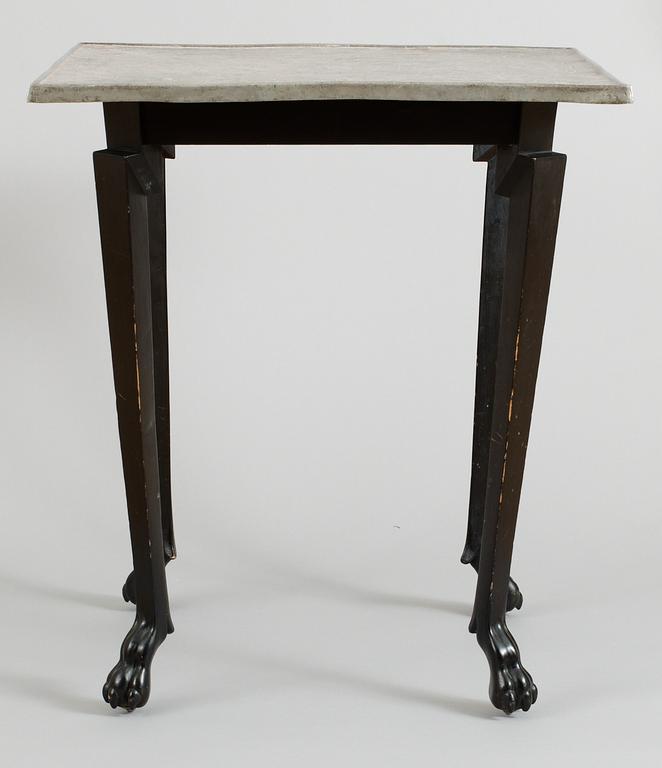 An Anna Petrus table, Stockholm circa 1922; pewter top and black wooden legs.