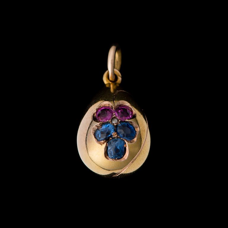 A PENDANT, facetted rubies and sapphires, 14K (56) gold. Russia, c. 1900.