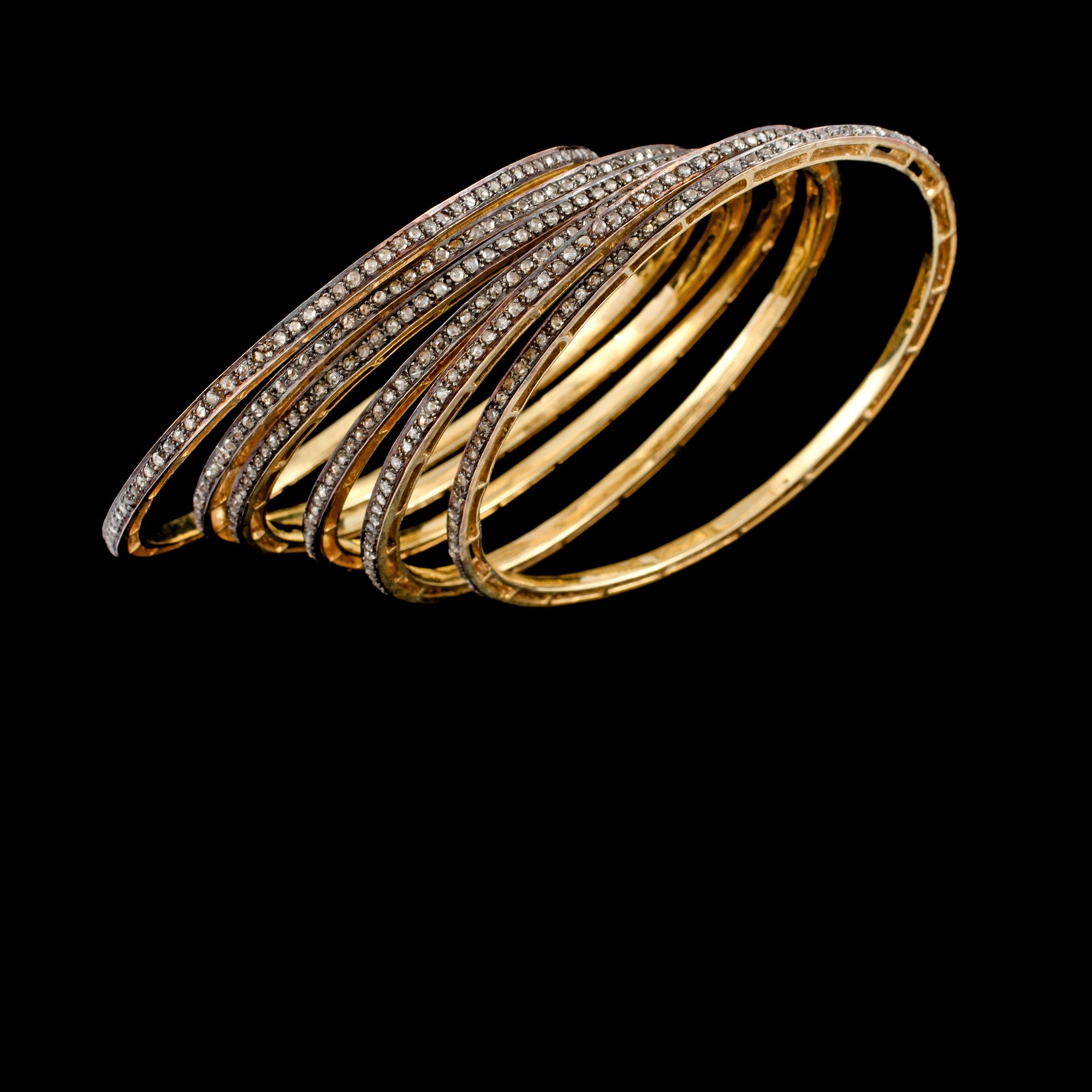 ARMRINGAR, 6 st, guld på silver samt fasettslipade bruna diamanter, 11.90 ct. Vikt 63 g.