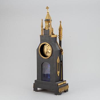 A gothic revival mantel clock.