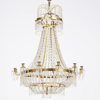 A Swedish gilt brass and cut glass thirteen-light Empire chandelier, early 19th century.