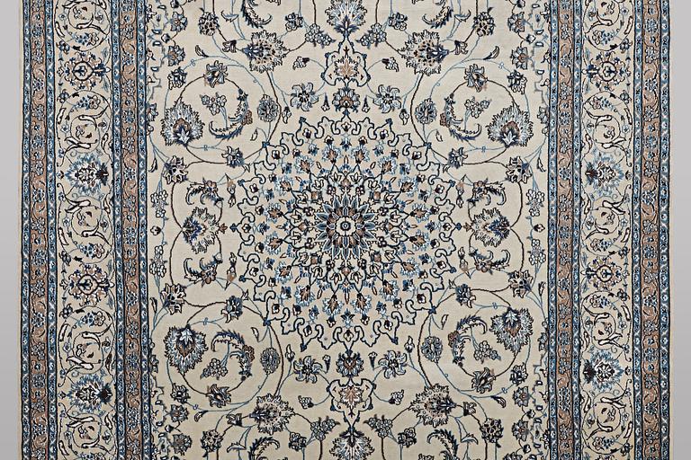 A carpet, Nain, part silk, 9 laa, c. 307 x 203 cm.