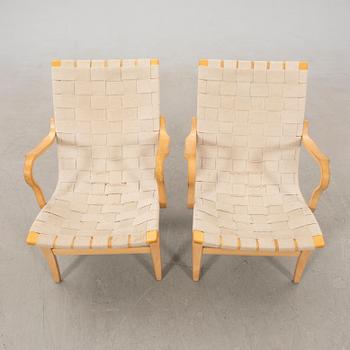 Bruno Mathsson, a pair of "Eva" armchairs for DUX, late 20th century.