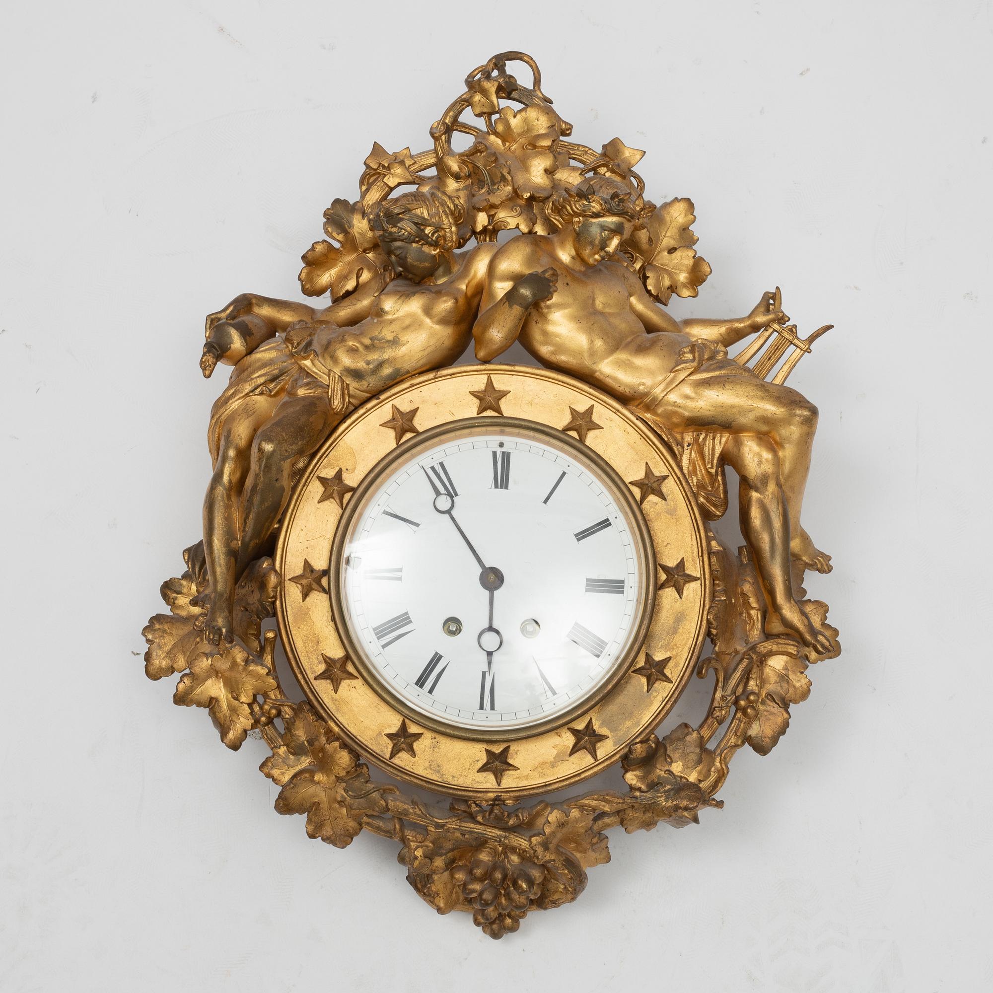 An Empire wall clock, 19th Century.
