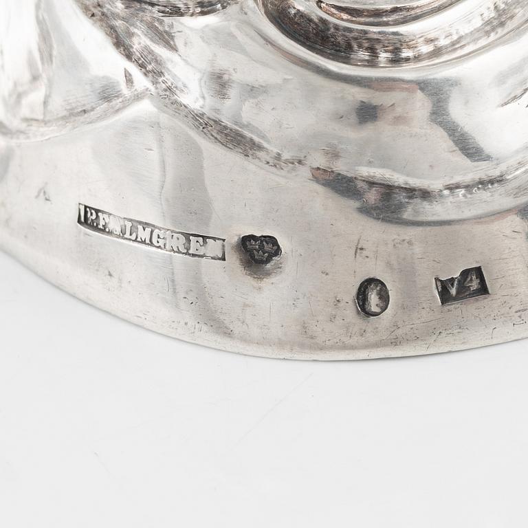 A pair of rococo style silver candle sticks by Pehr Fredrik Palmgren, Stockhom 1851.