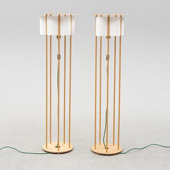 Torbjörn Ahlström, a pair of birch floor lights, dated 1993.