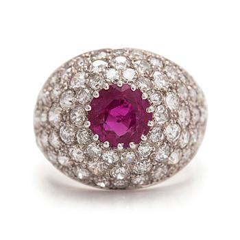An 18K white gold bombe ring, ruby and diamonds totalling approximately 1.26 ct, CF Carlman, Stockholm 1971.