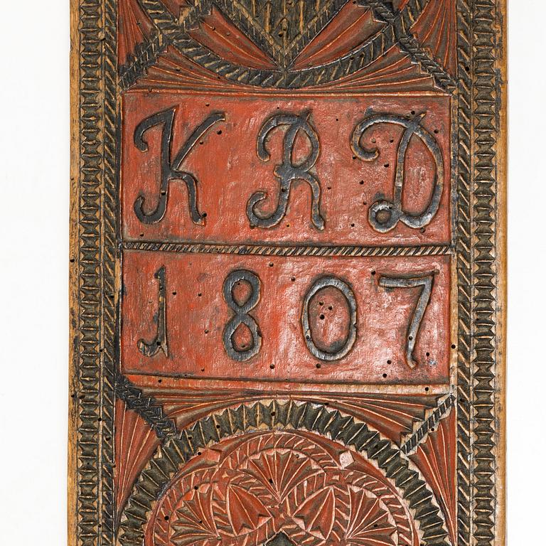 A painted wooden mangle board, Southern Sweden, dated 1807.