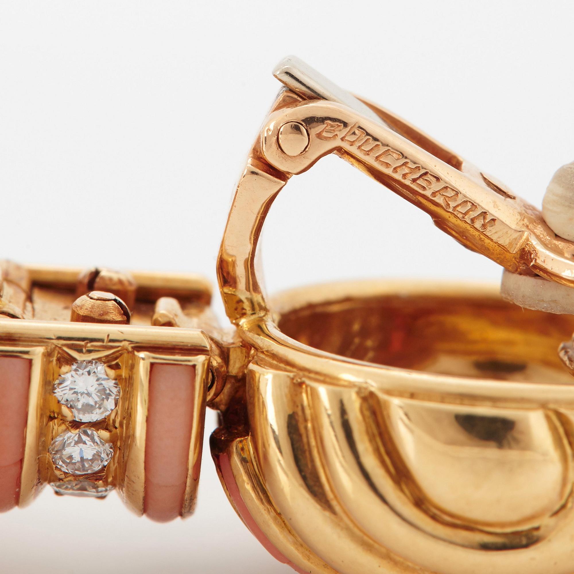 A pair of 18K gold Boucheron earrings set with round brilliant-cut diamonds and coral.