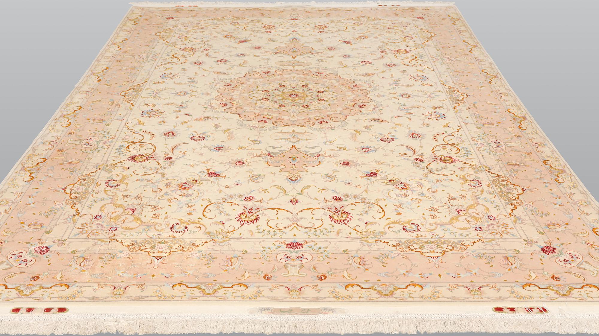A Tabriz part silk carpet, signed, 305 x 203 cm.