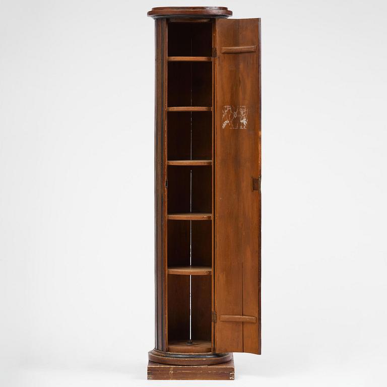 A Swedish Empire column-shaped cabinet, first part 19th century.