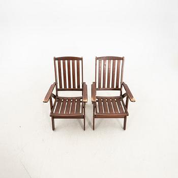 A set of five stained wood garden chairs from KWA around year 2000.