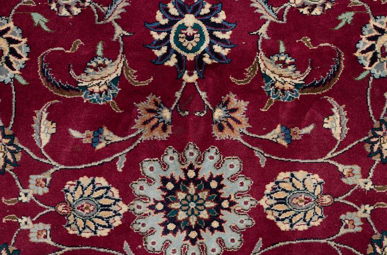 An oriental carpet, a. 378 x 278 cm.