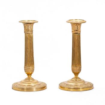 LJUSSTAKAR, ett par, empire, brons, 1800-talets första hälft.