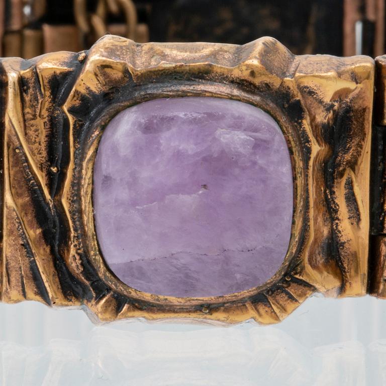 A bronze bracelet set with amethysts by Pentti Sarpaneva.