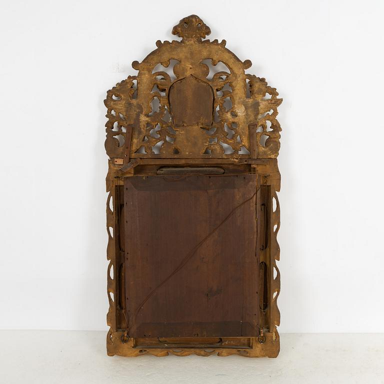 A South German Baroque carved giltwood mirror, early 18th century.