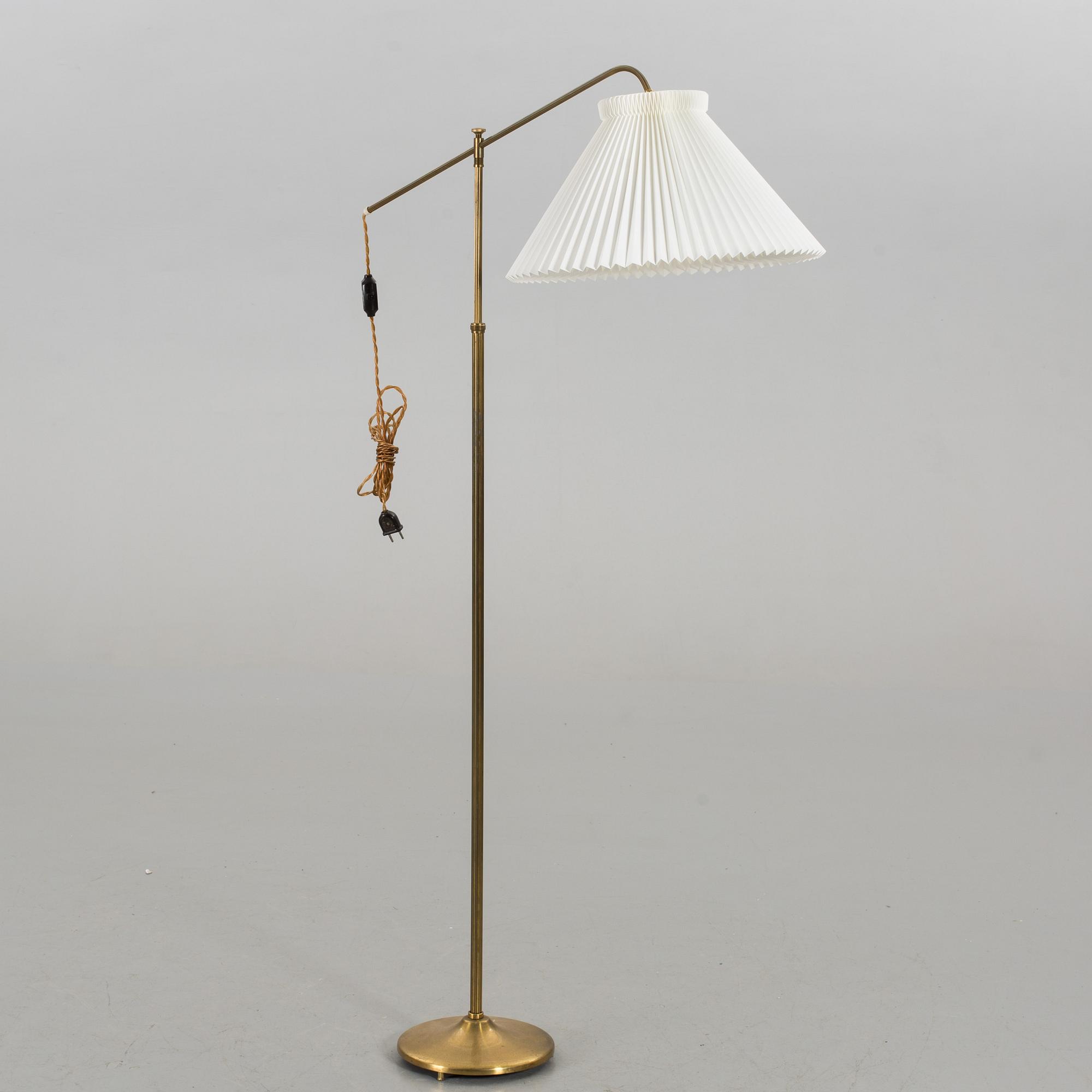 A mid 20th century floor lamp with a Le Klint shade.