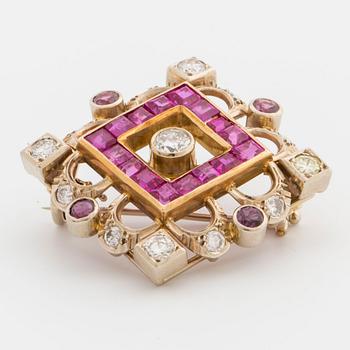 A 14K gold brooch with diamonds,