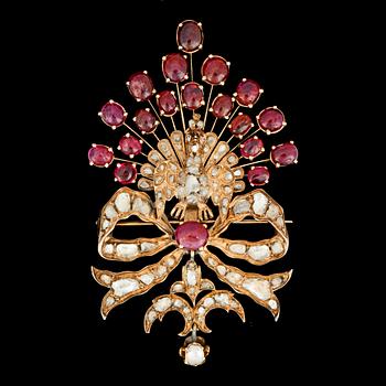 140. A cabochon ruby and rose cut diamond brooch, designed as a peacock.
