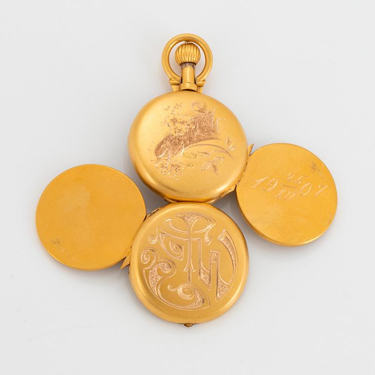 A 14K engraved gold locket.