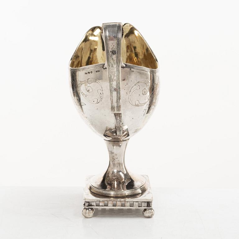 A Swedish Gustavian parcel-gilt silver sauce jug, mark of Daniel Hallman, Stockholm 1810.