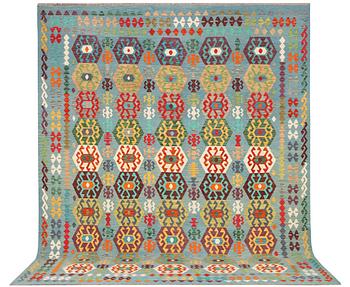 A Kilim carpet, c. 392 x 312 cm.