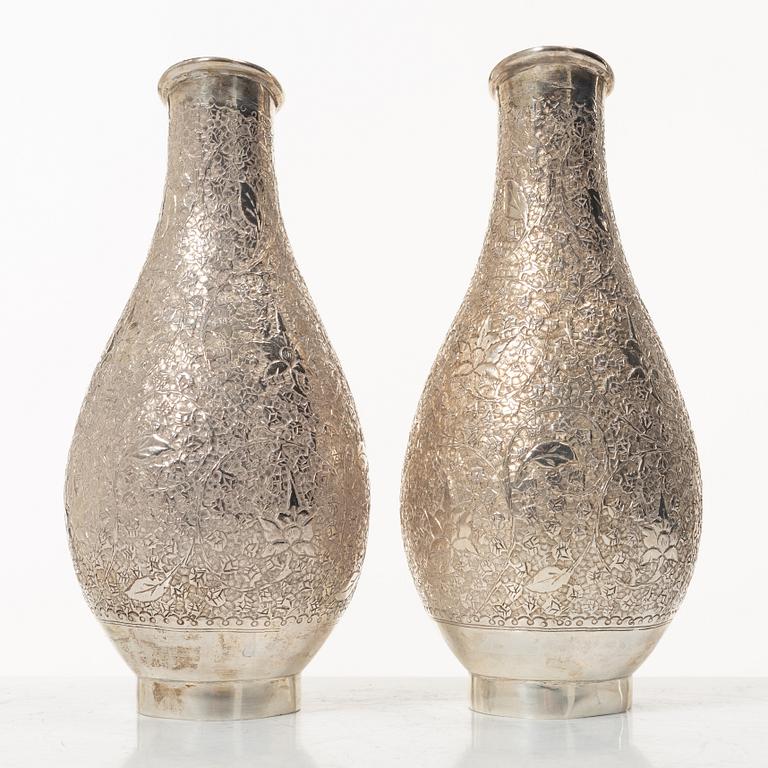 A pair of jugs, silver, Pakistan, mid-20th century.