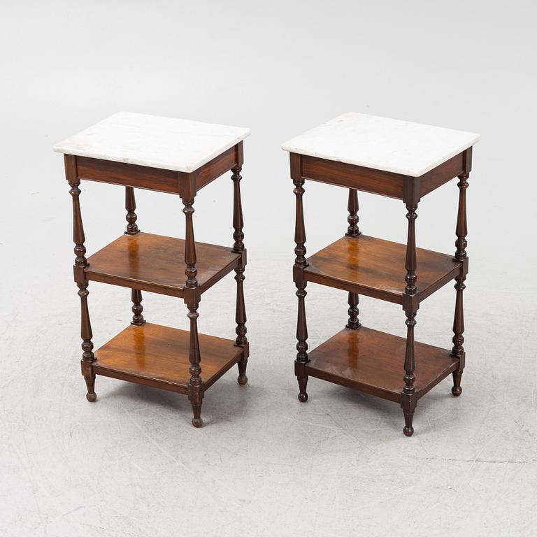 A pair of bedside tables with marble tops, from around the year 1900.