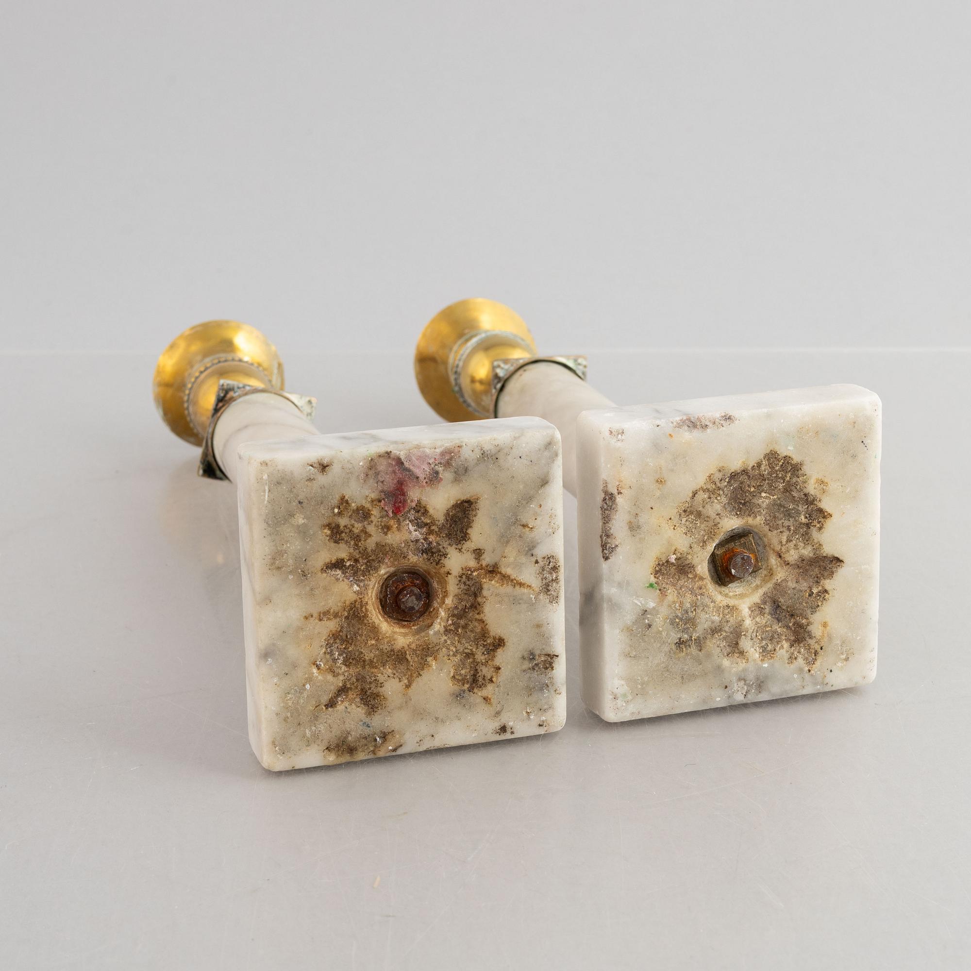 A pair of Gustavian gilt brass and marble candlesticks, late 18th century.