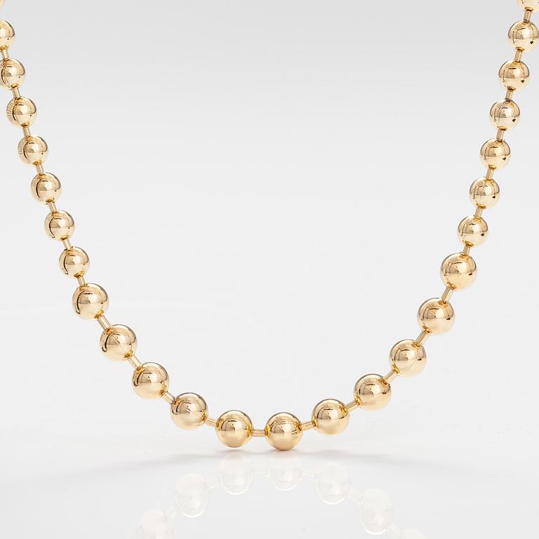 DIOR. A necklace and a pair of earrings in gold coloured metal. Marked Chr. Dior, Germany.