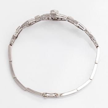 A platinum bracelet, set with brilliant- and single-cut diamonds.
