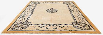 An antique Chinese carpet, 404 x 304 cm.