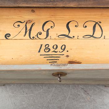 a chest of drawers from the first half of the 19th century.