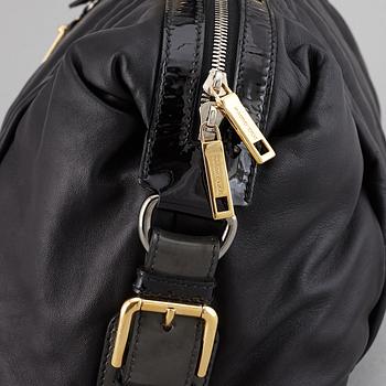 DOLCE & GABBANA, a black leather bag.