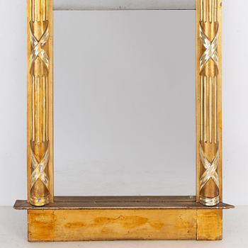 An Empire mirror, first half of the 19th century.