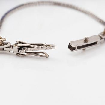 A platinum bracelet with old-cut diamonds ca. 1.46 ct in total, a synthetic sapphire and sapphires. Early 20th century.