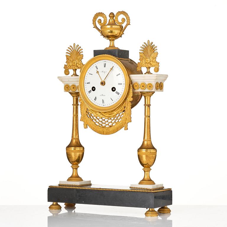 A late Louis XVI ormolu and marble portico clock, Paris, latge 18th century.