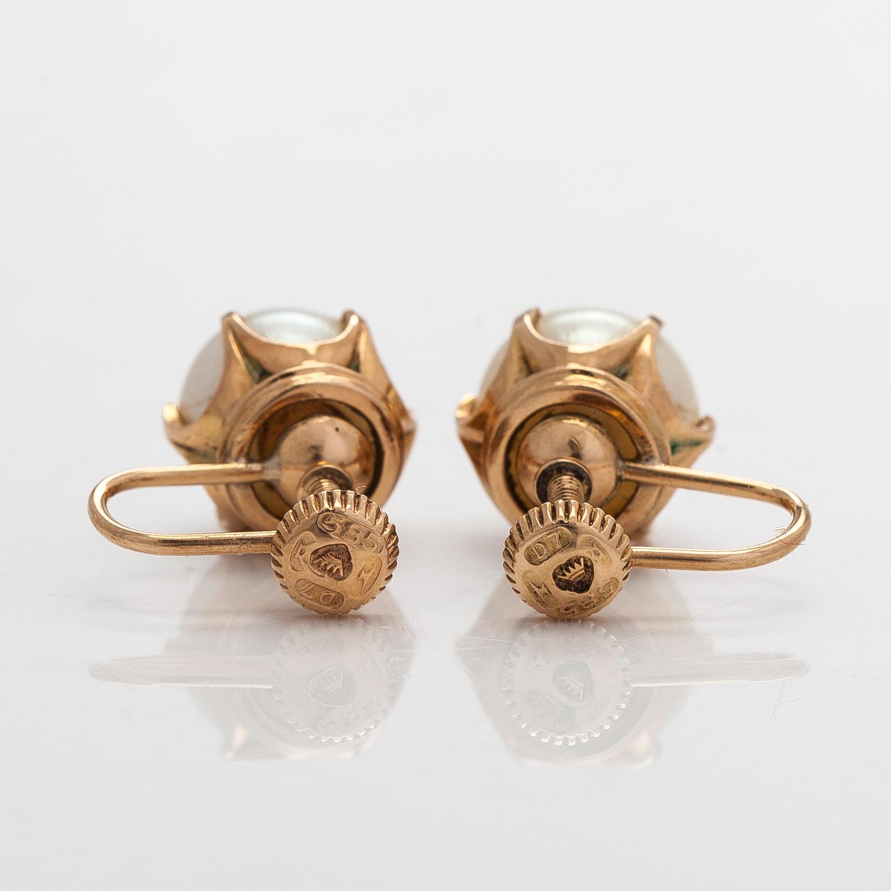 A pair of 14K gold earrings with cultured pearls.