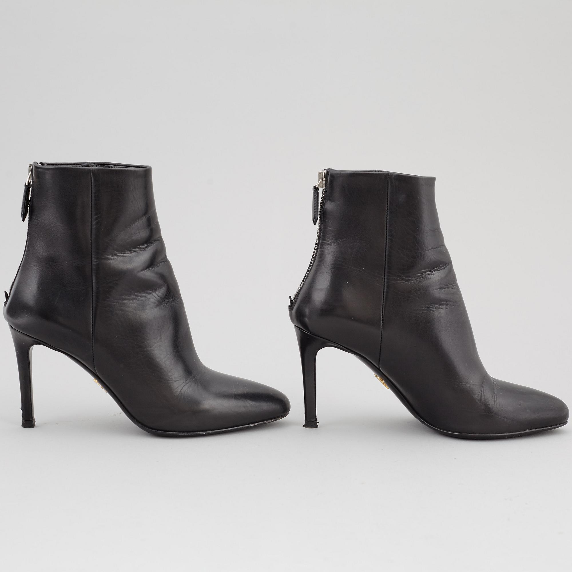 PRADA, a pair of black leather boots, size 35.