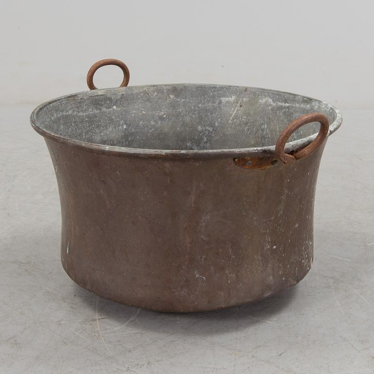 A 19th century copper cauldron.