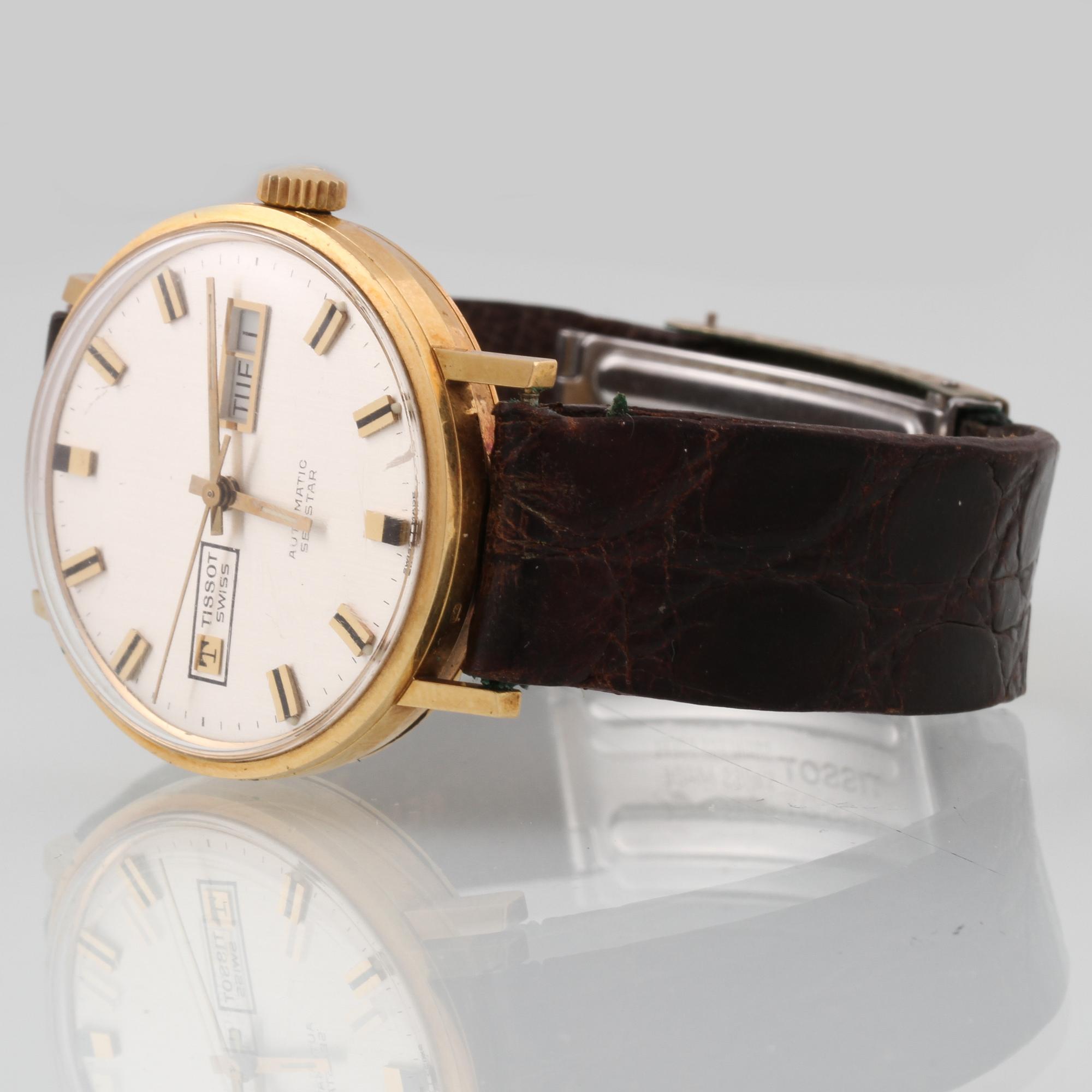 ARMBANDSUR, 18 k guld, Tissot, "seastar".